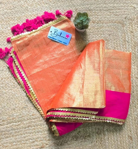 Megha | Golden Orange Tissue Saree with Rani Pink Border