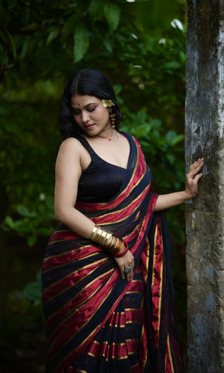 Noor | Party Black and Ruby Red Mul Mul Cotton Saree with Golden Zari Stripe