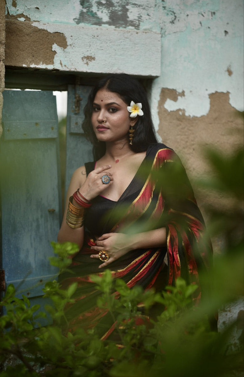 Noor | Party Black and Ruby Red Mul Mul Cotton Saree with Golden Zari Stripe