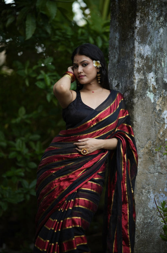 Noor | Party Black and Ruby Red Mul Mul Cotton Saree with Golden Zari Stripe
